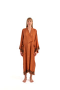 Cotton-linen nubi kimono in terracotta with V-neck and wide sleeves, tassel trim