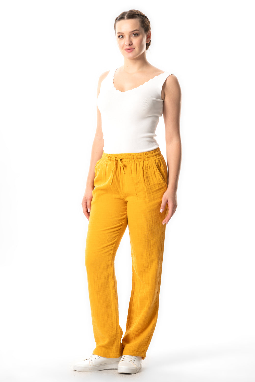 Mustard cotton muslin trousers with elastic waist and drawstring ties, straight legs