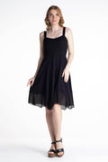 Black sleeveless cotton dress with narrow straps and gathered flared skirt, above-knee