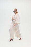 Light beige pleated palazzo trousers with wide legs and flowing drape