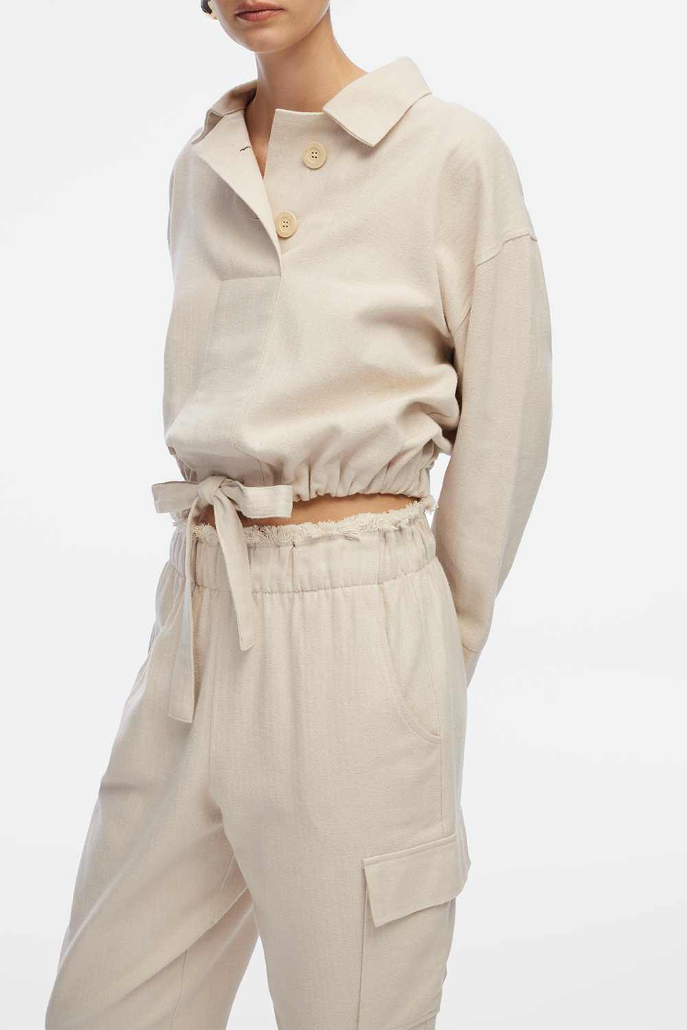 IKIKIZ women's cream cotton herringbone polo top with drawstring hem and cotton herringbone texture